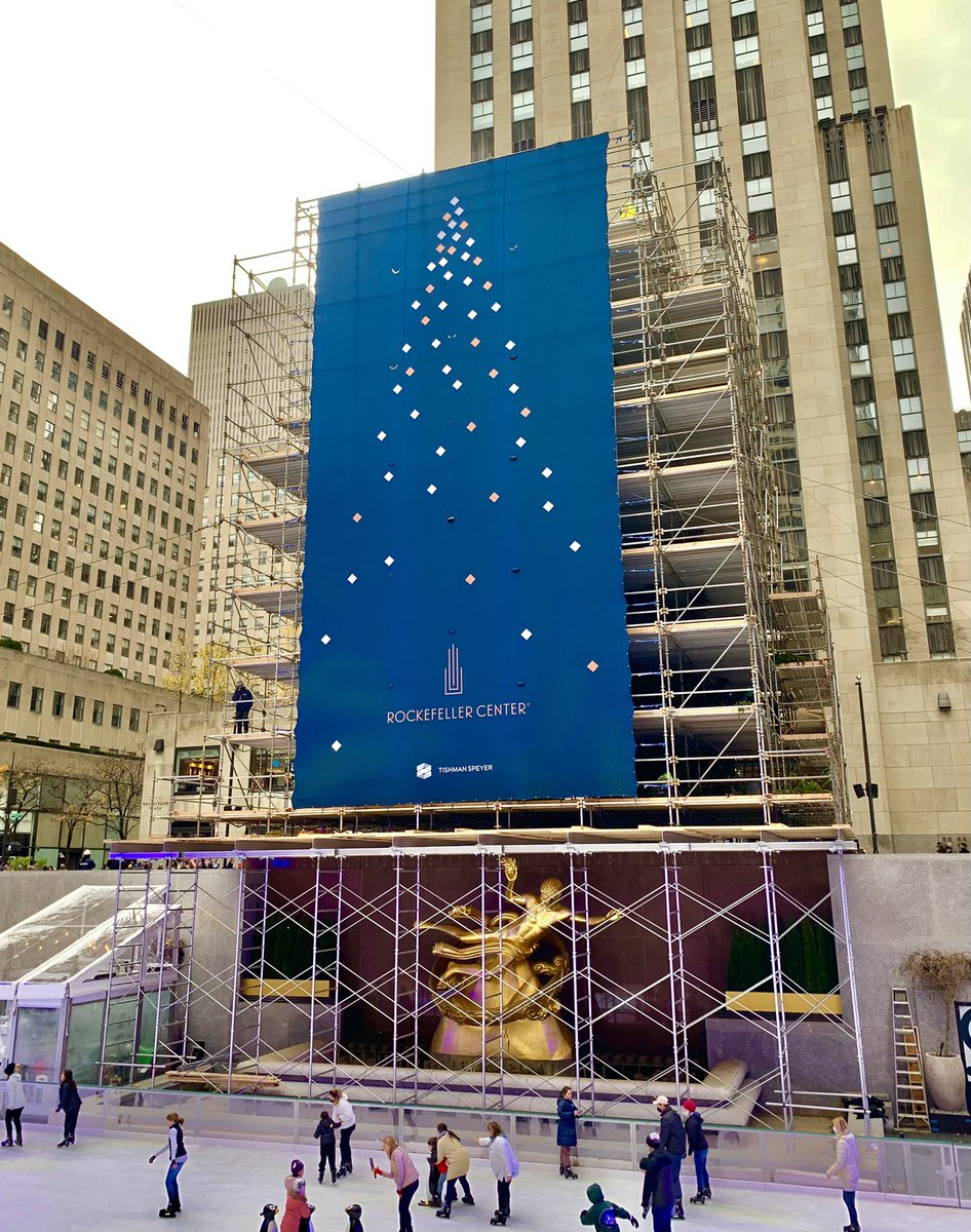 Tis the season: With apologies to the Wizard of Oz: “Pay no attention to that tree behind the sign…” #rockefellercenterchristmastree #rockefellercenter #rockcenter  <a href="/rockcenternyc/">Rockefeller Center</a>