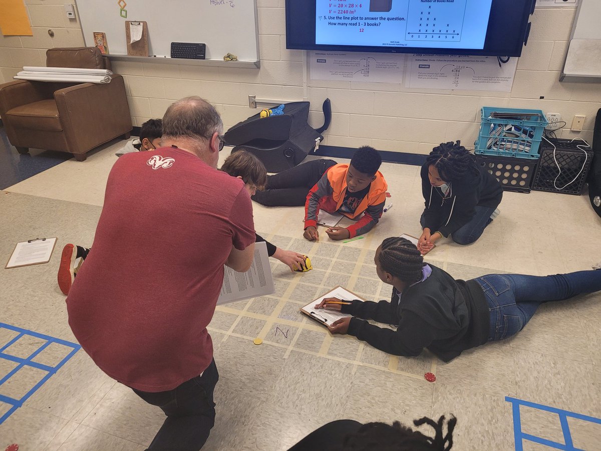 MrsJennBurdette's tweet image. Students in Mr. Mathis's class use Bee-Bots to find locations on a coordinate plane. Graphing made fun! @RAMiddle_RAMS #RAMSinspire #a5instruction