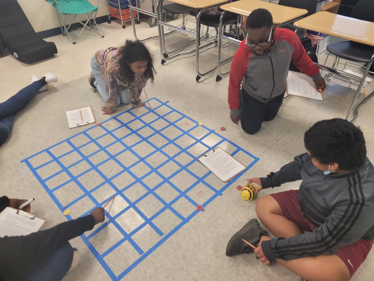Students in Mr. Mathis's class use Bee-Bots to find locations on a coordinate plane. Graphing made fun! <a href="/RAMiddle_RAMS/">Robert Anderson</a> #RAMSinspire #a5instruction