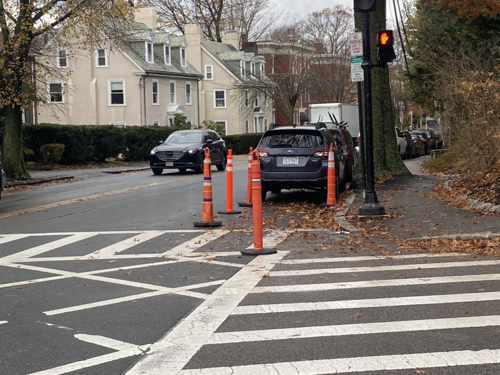BlineTransport's tweet photo. Notice: the traffic signal at Longwood &amp; Kent has been reprogrammed to an exclusive pedestrian phase. So all 🚗🚛 stop when 🚶🏿🚶‍♂️walk. Temporary curb extensions have been created using 48inch cones. Bollards bolted into the pavement will replace the cones once they arrive. https://t.co/4iCKNgk4e4