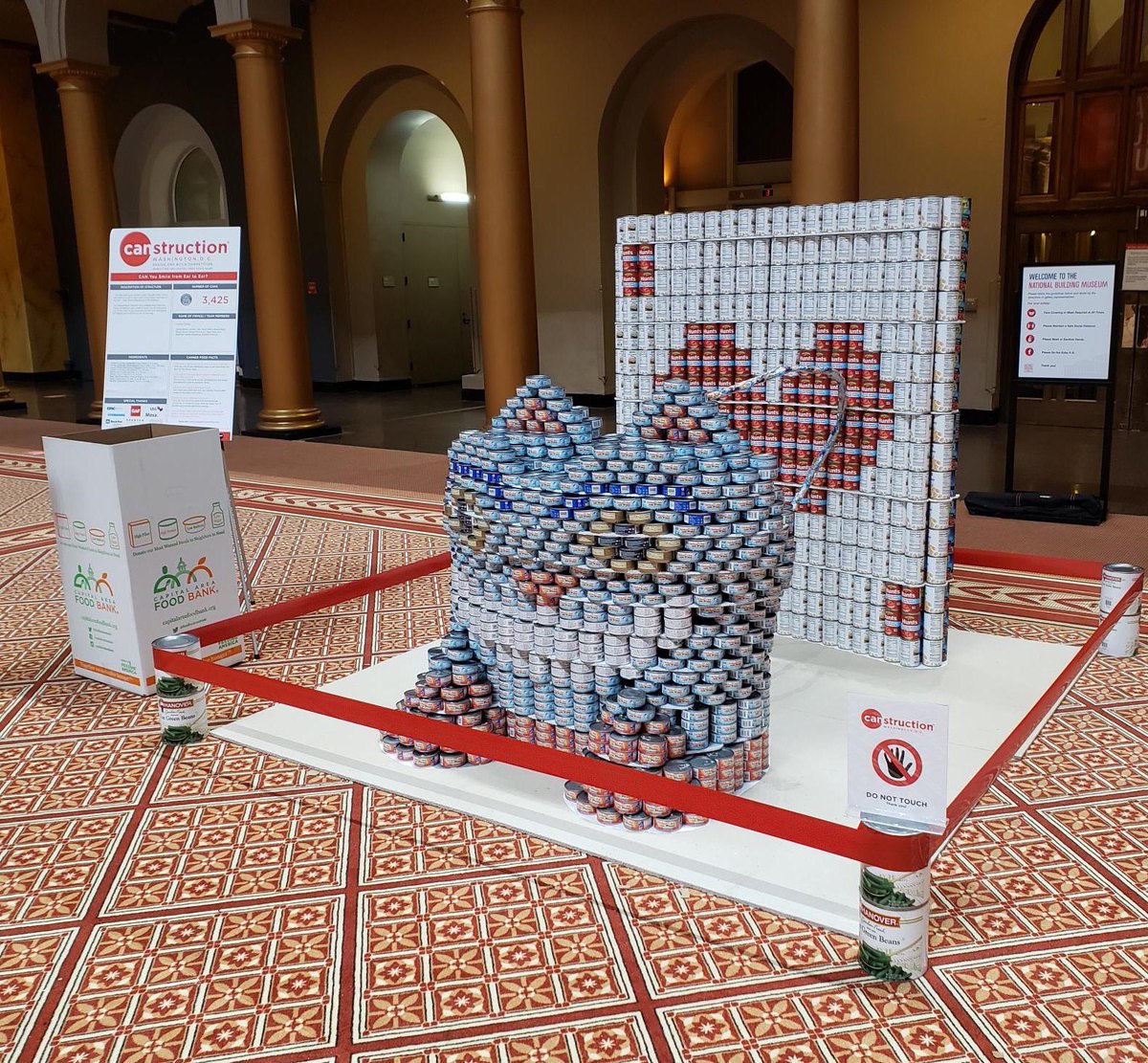StephenNParker's tweet photo. Built something cool w/ @carrieleeparker @CannonDesign. Special thx to @HDarchitectural &amp; our sponsors for helping us create this #CheshireCat sculpture out of 3,425 cans! @BuildingMuseum @WashingtonDCAIA @WashArchFound @foodbankmetrodc #canstructionDC @Canstruction https://t.co/1N0znYR87X