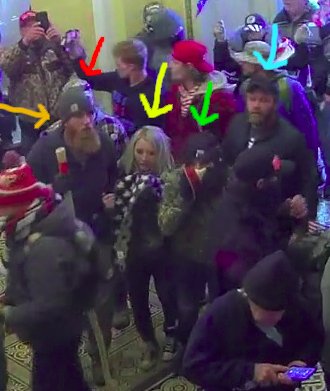 SometimesUsefu2's tweet photo. #CurlyPlaid is holding onto a guy with a bushy red beard. He, in turn, is arm-in-arm with a woman with blonde hair and a starry scarf. She is wearing Converse sneakers, so she is not #JenniferRyan (who wore DKNY shoes) or #KatieSchwab (who wore light brown work boots). 2/4 https://t.co/KBDdKZMbez