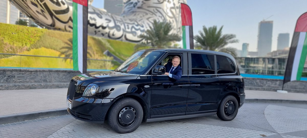 grantshapps's tweet photo. Bringing the UK to Dubai! With @LondonEVcompany iconic British black cab - first in UAE with many more to come. Electric cabs manufactured in Coventry, loved around the world @tradegovuk @annietrev #globalbritain https://t.co/t3kNJh9SY7
