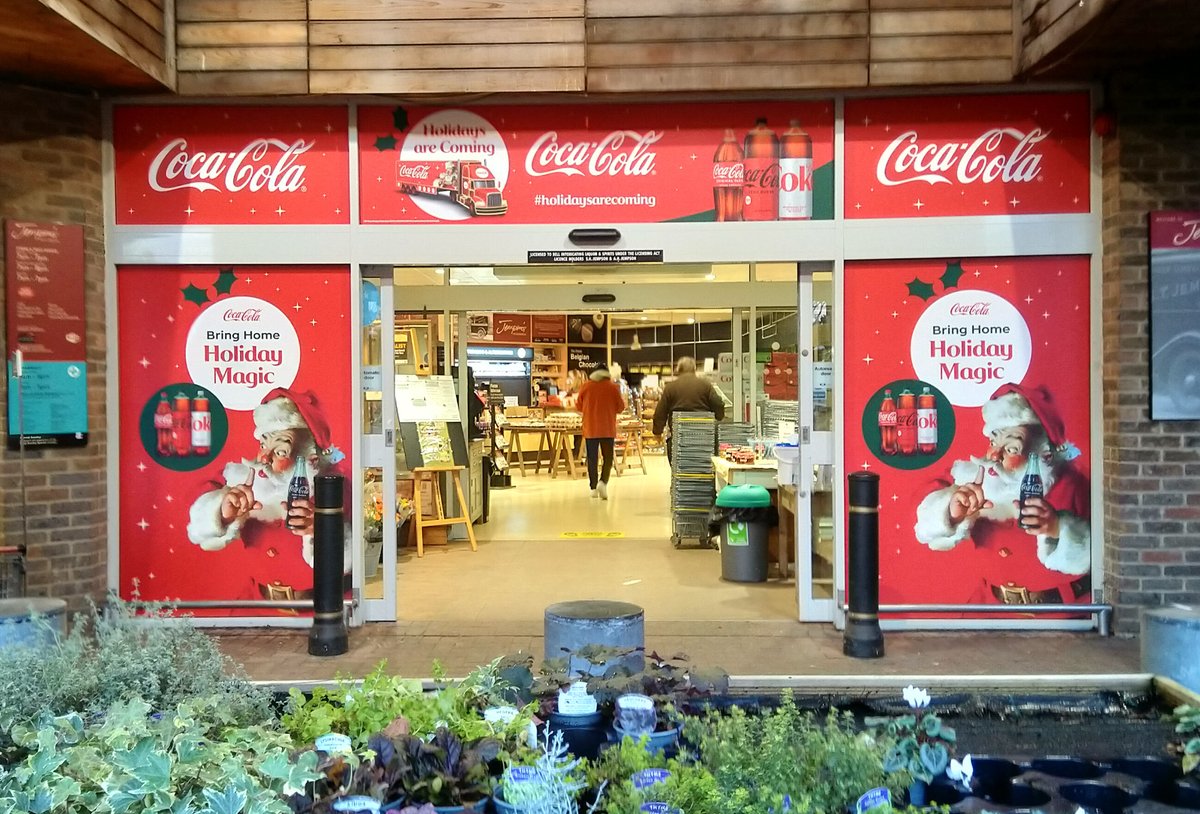 CareSigns's tweet photo. Santa arrived early again this year @jempsonsstores Superstore, Peasmarsh, this morning. Some great new festive @CocaCola_GB store entrance POS window graphics. #ryeeastsussex #ryebusiness #ryelocals #tenterdenkent #cocacola #shoplocalforchristmas #peasmarsh #windowgraphics https://t.co/VDl1QU9GR9