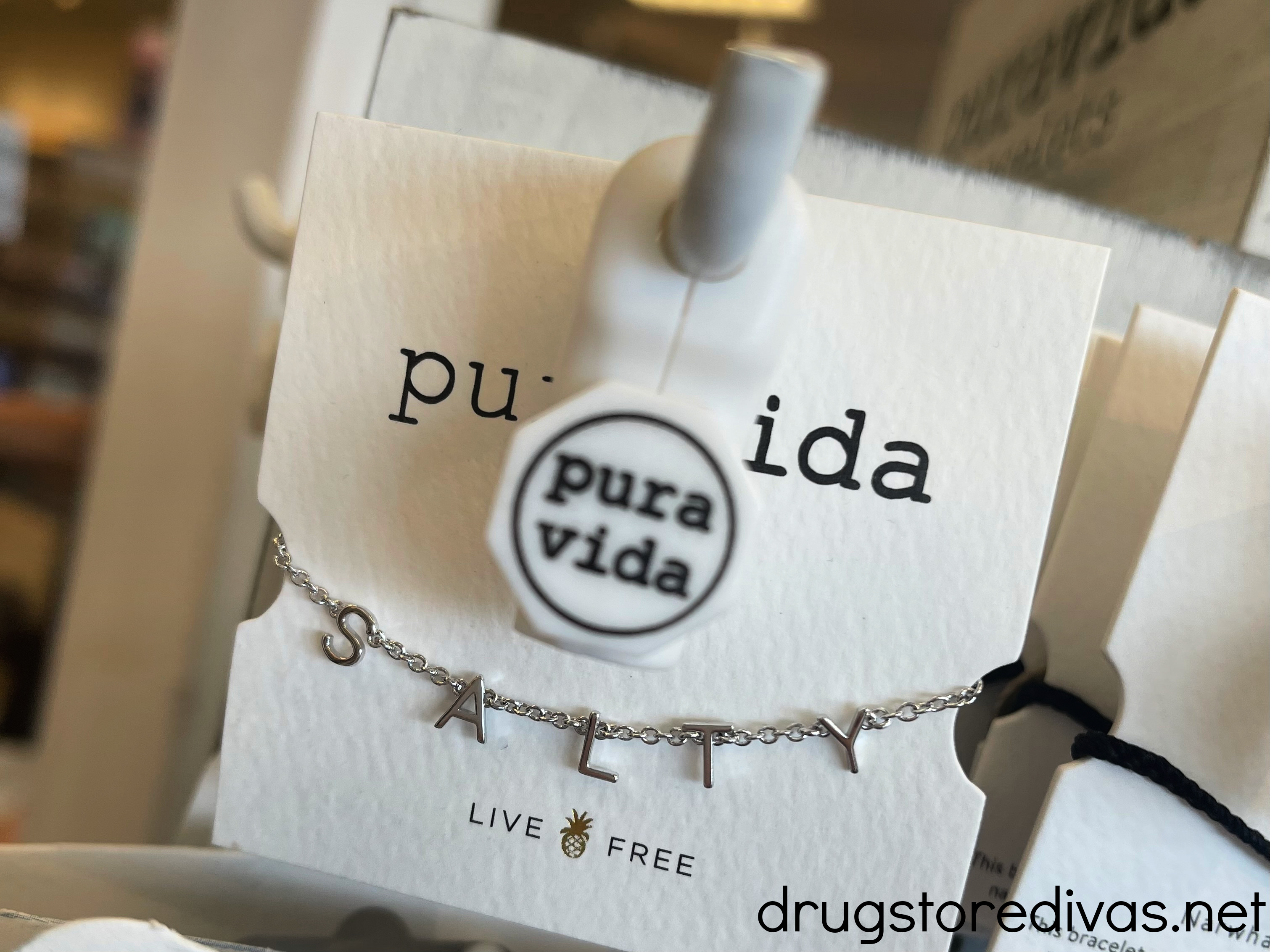 A Pura Vida bracelet on the shelf.