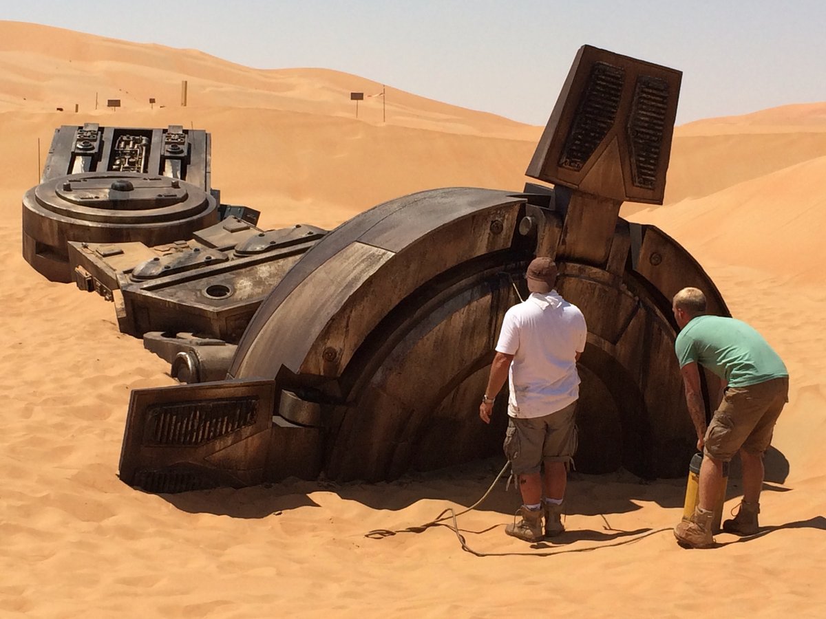 DGilfordDesign's tweet photo. A derelict AT-AT buried in the sand on Jakku in @StarWars #TheForceAwakens served as Rey’s home. We built part of a full size AT-AT leg and dressed it into the Abu Dhabi desert.  Rey charges up this set piece as she’s about to meet BB-8. #ProductionDesign #StarWars #Disney https://t.co/rw6AyPiPkf