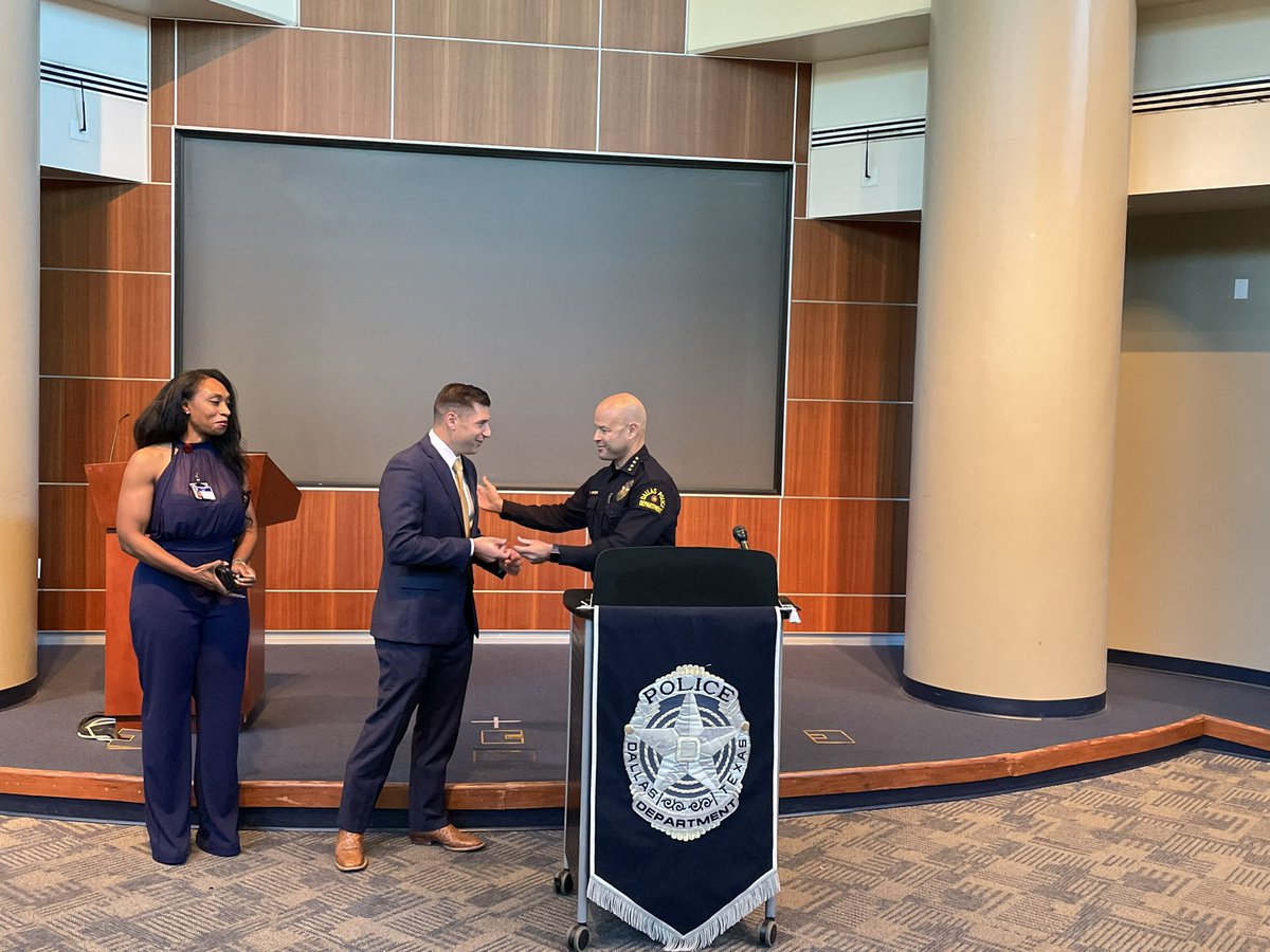 Detective Frank Serra is presented with a lifesaving bar by Dallas PD ...
