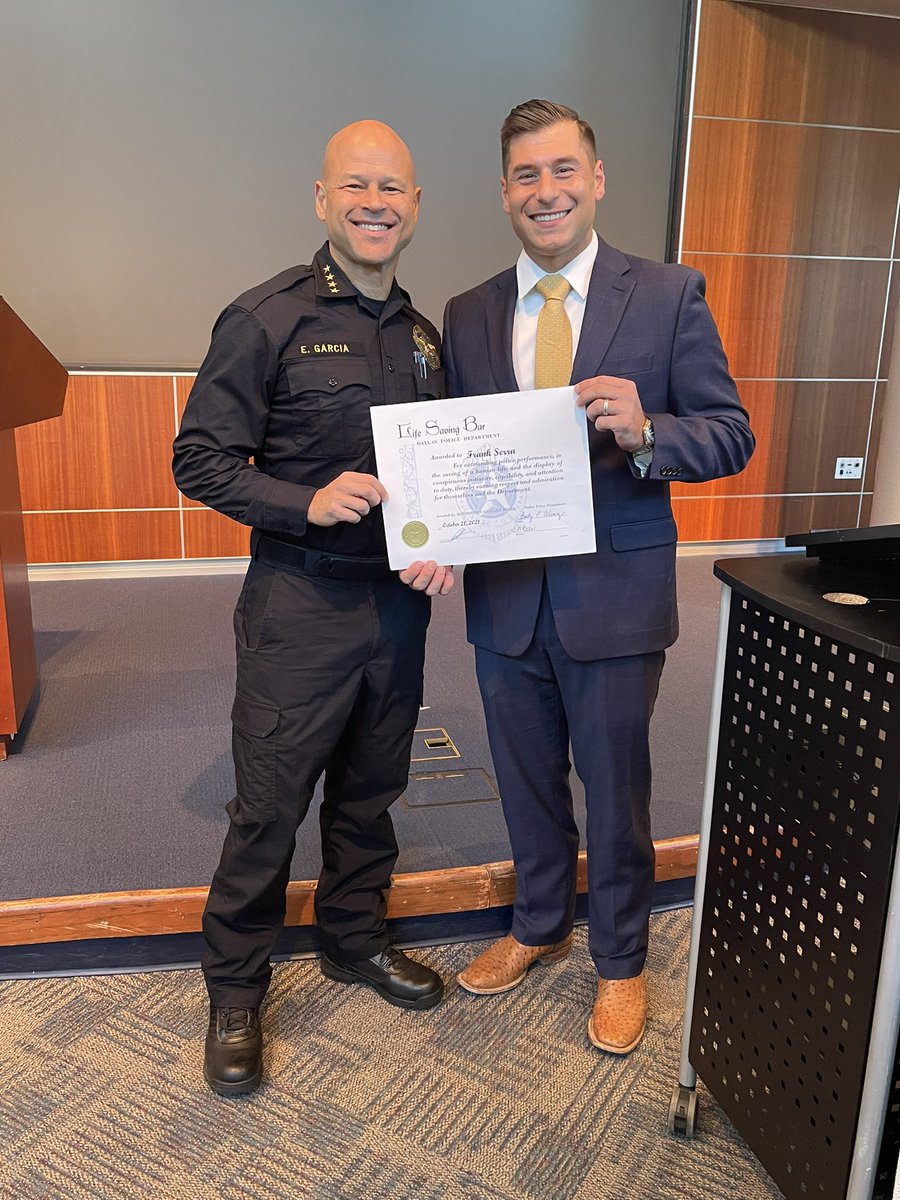 Detective Frank Serra is presented with a lifesaving bar by Dallas PD ...