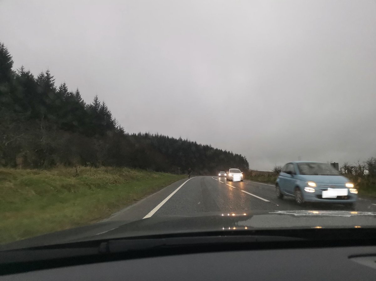 NIRoadPolicing's tweet photo. Nobody wants to play “Spot The Cyclist”!
Officers from Road Policing Maydown provided this cyclist on the Dunhill Road with a hi vis jacket to see him safely home. Especially at this time of year, make sure you are easily seen, as demonstrated in photo 2. #KeepingPeopleSafe https://t.co/i8hE3eyfuw