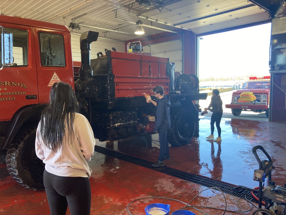 MVHS_AD's tweet photo. Coach Maberry and the MV students are shining up the trucks at the MVFD. #MtNeerServe https://t.co/OV07NQbEjl