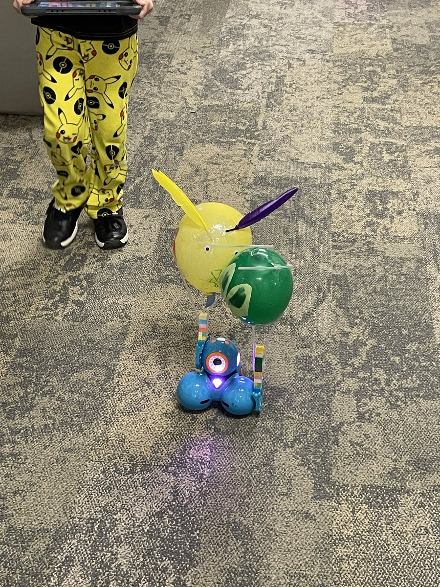 Balloons Over CRE. Ss measured their parade route in cm and coded dash to parade their balloons down the hall.