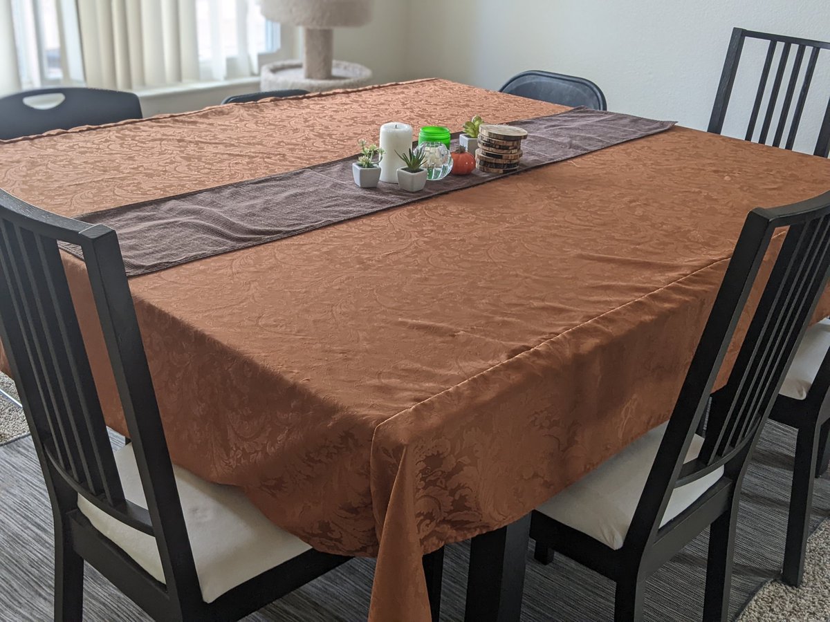 Yesterday, picked up some fabric from the thrift shop. With a little bit of cutting and sewing to reconfigure some extra width, we now have a fancy tablecloth to blend our dining table and plastic folding table into one.

#sewing #thanksgivingdiy #Thanksgiving