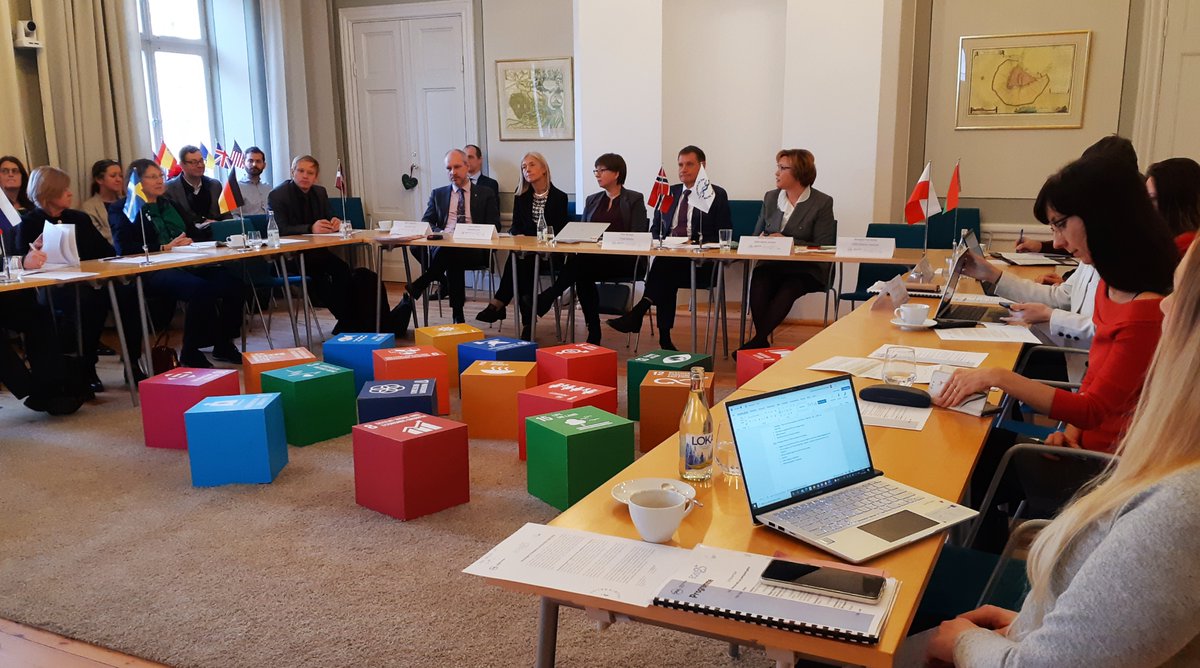 Our Expert Group is gathered around the colourful SDGs for their anniversary meeting, looking back at the work done in the last 25 years of the group's work and forward into the future: promoting green transition, industrial symbiosis and sustainable cities are on the agenda.