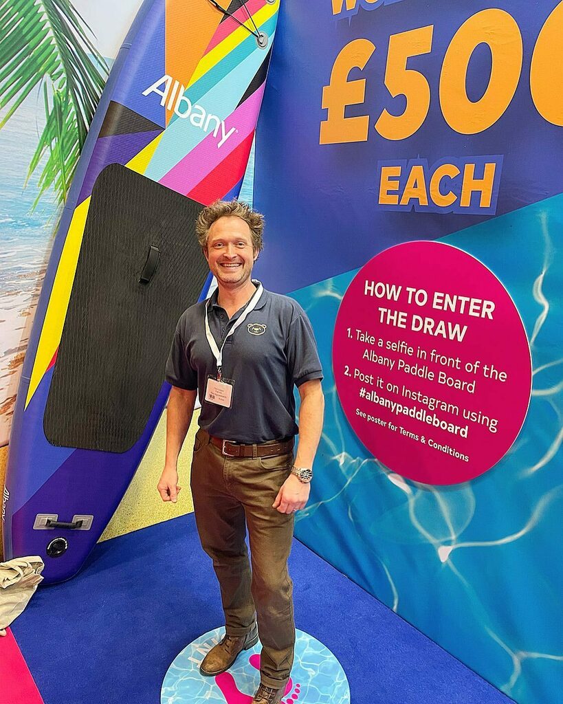 BearImp's tweet image. Press-ganged by @lauren_pics_life into having a photo taken in front of #albanypaddleboard on the @brewerspaints stand at #pdshow2021 @pd.show 😜 instagr.am/p/CWqS6AAIuRT/