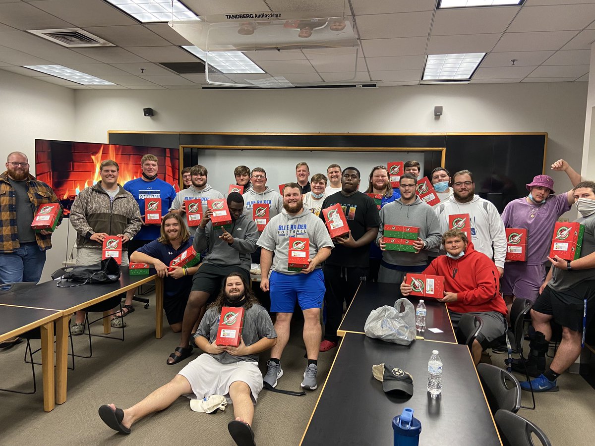 CoachDamGC's tweet photo. The big guys up front may be nasty and mean on the field but have big hearts and enjoy helping others in need off the field. The OL did a great job stuffing some boxes for  @OCC_shoeboxes ! https://t.co/z6Bt7gtmYb