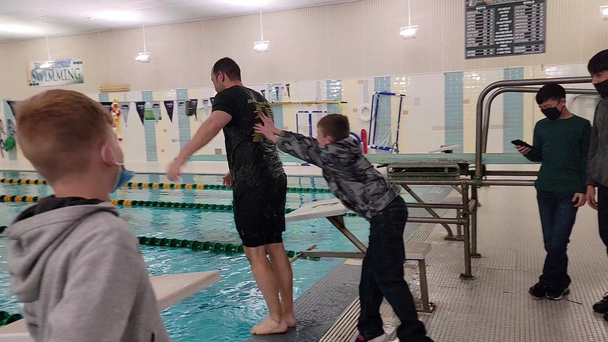 OPS_BryanMiddle's tweet photo. Students cashed in Dojo Dollars to get to push a staff member pushed into the pool. Mr. Karmazin was the lucky winner of the push. The one pushed turned into 15! Way to showcase your 4 Be's! #BMSBearPride The video will be shared later! https://t.co/4YxI01WGNZ
