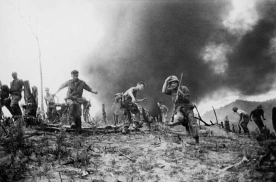 U.S. Marines scatter as a CH-46 helicopter burns, background, after is was shot down near the demilitarized zone (DMZ) between North and South Vietnam, July 15, 1966. At least 13 Marines were reported killed in the crash, with three badly burned. https://t.co/hLGQhMFhd9