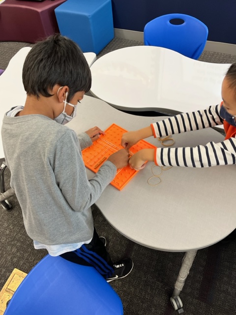 Kindergarten &amp; First Graders exploring Storybook STEAM with the Very Busy Spider by Eric Carle. Students used geo boards and rubber bands to replicate orb, sheet, or cob webs. <a href="/CollinsElemSch/">Collins Elem School</a>