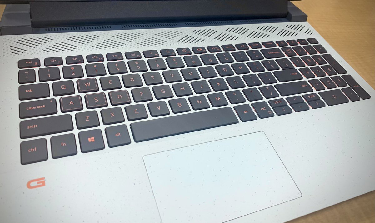 JoshuaMFrench's tweet photo. In love with this Dell G15 — the speckled shell and sharp edges, subtle blue/grey coloring, comfortable LED-lit keyboard, the durable heft, the total quiet of its fans, snappy performance… I could go on. Highly recommended if you want a laptop that feels unique. #ObsessionWorthy https://t.co/GANldBR8vF