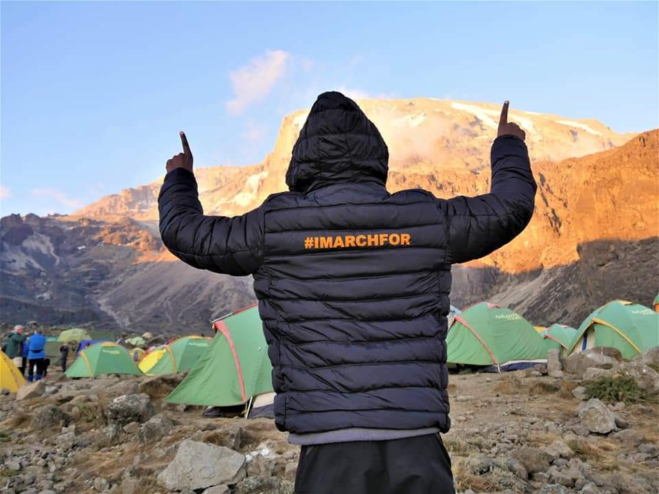 OlajideDemola's tweet photo. A year ago we hoisted the ICPD25 banner on the rooftop of Africa; on Mount Kilimanjaro. #TheMarchContinues to deliver on the promise of Cairo! #IMarch in the promotion of harmony between people and planet! @UNFPAKen @Atayeshe https://t.co/hPcqutYru1
