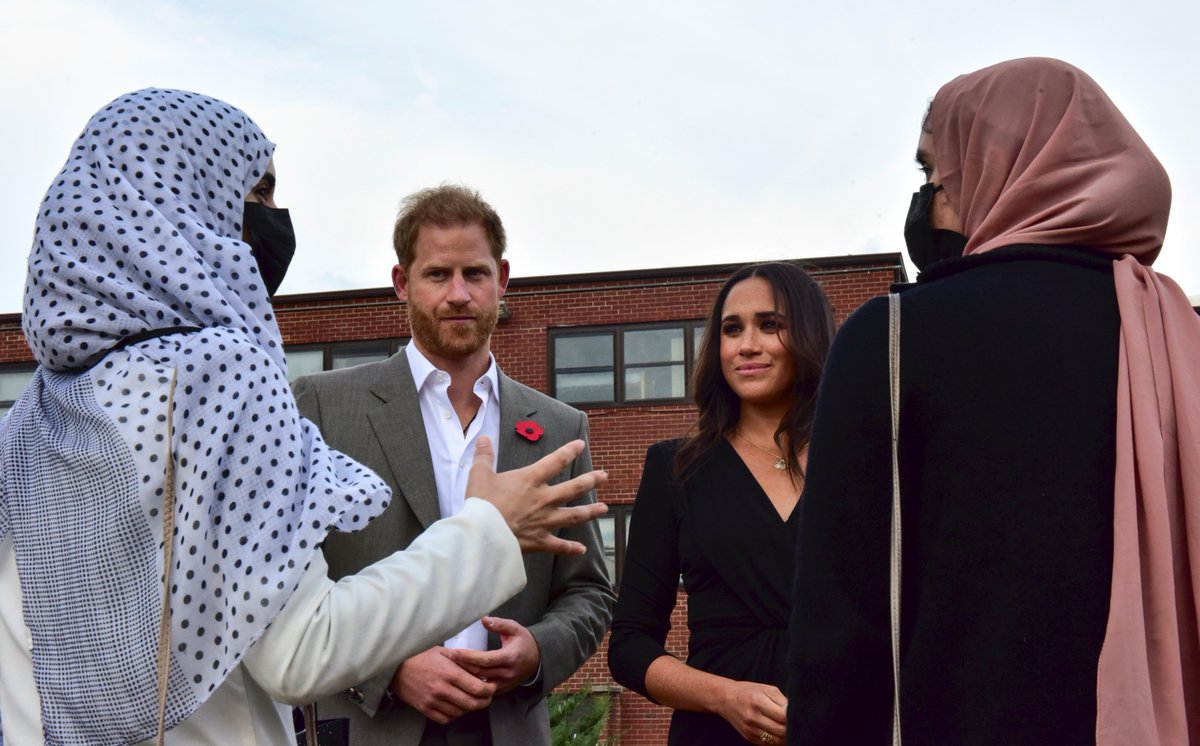 scobie's tweet photo. During their @jointbasemdl visit, the Sussexes also spent time at Task Force Liberty, home to over 10,000 Afghan refugees. The couple spoke with women who recently arrived at the base, which provides transportation, temporary housing, medical care, and support for evacuees. https://t.co/Da5YXeSZPG