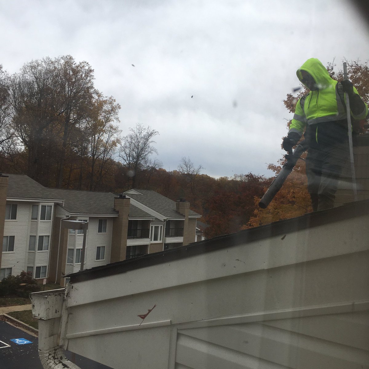 Heath_Bar's tweet photo. Some yard work being done one the roof this morning. That is one way to clean the gutters and roof of the pesky rogue leaves. #fall #yardwork #leafblower https://t.co/XNR7jF0jb1