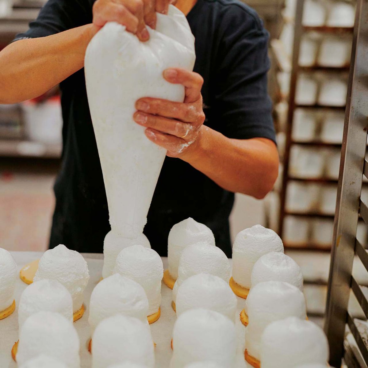 What goes into our signature Dark Chocolate and Coconut Puffs? Freshly made marshmallow piped high on top of a marzipan base.