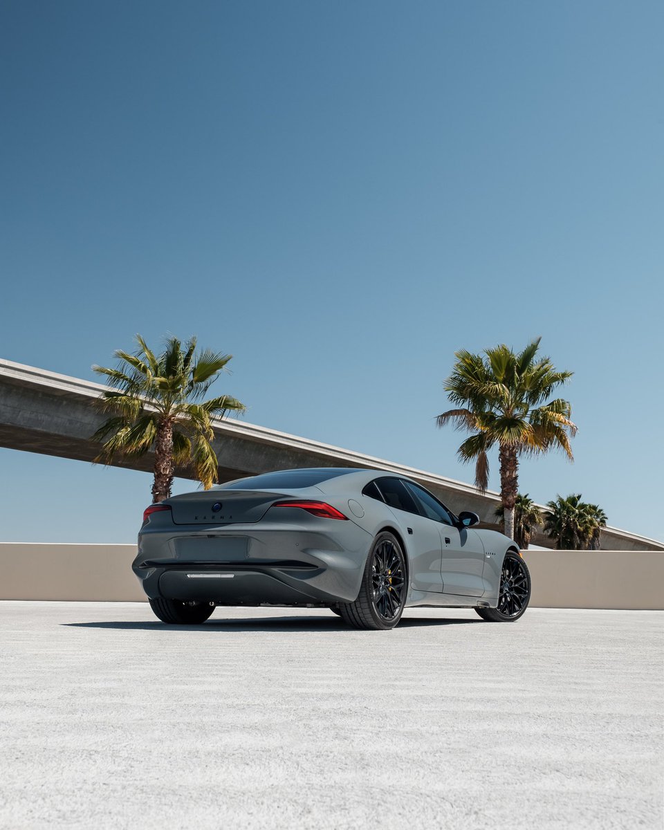 KarmaAutomotive's tweet photo. Our Pacifico Grey #GS6 lounging in the #california #sunshine today near our #kicc production facility. #chargedemotionbeyondev #karmaauto #karmaautomotive #climatepledge https://t.co/tCZ6uGD4RX