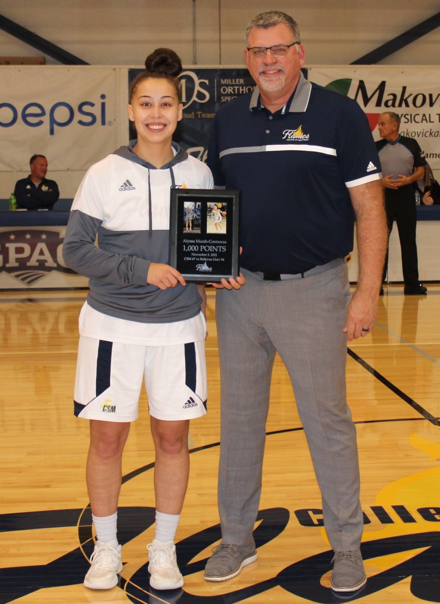 College of Saint Mary basketball player Alyssa Marsh-Contreras was recognized before today's game for scoring her 1,000th collegiate point recently. Marsh-Contreras played her first two full seasons at Peru State College before joining the Flames as a transfer student this fall.