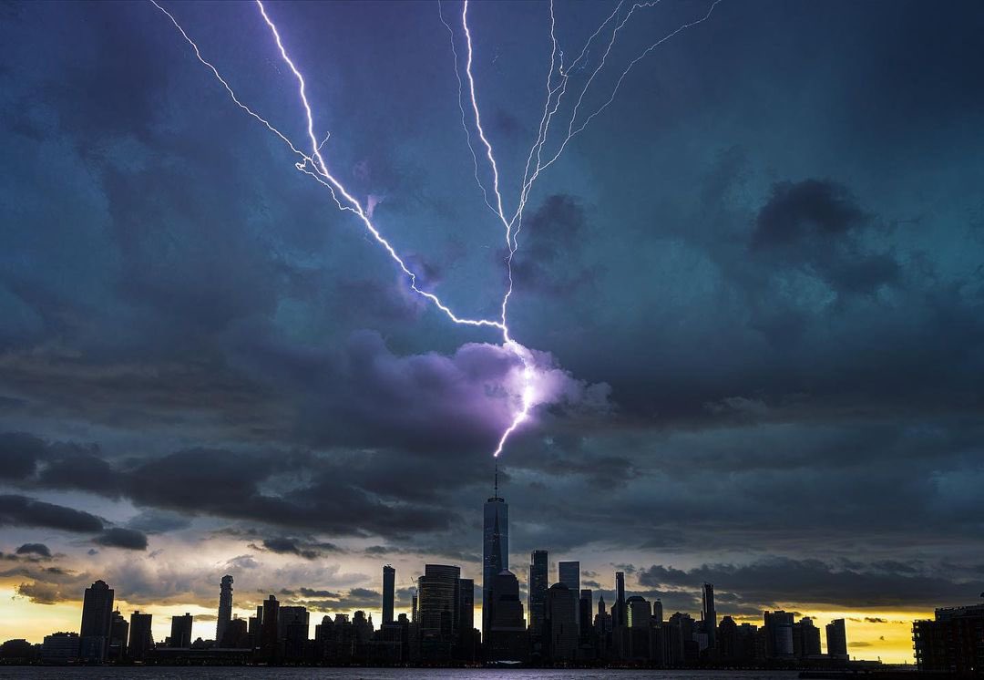 NashWX's tweet photo. One World Trade Center took multiple direct hits from lightning strikes this afternoon!

Photos sent in by: Dan Martland 
#weather #stormhour #nywx #nyc https://t.co/dHGmykb6Tw