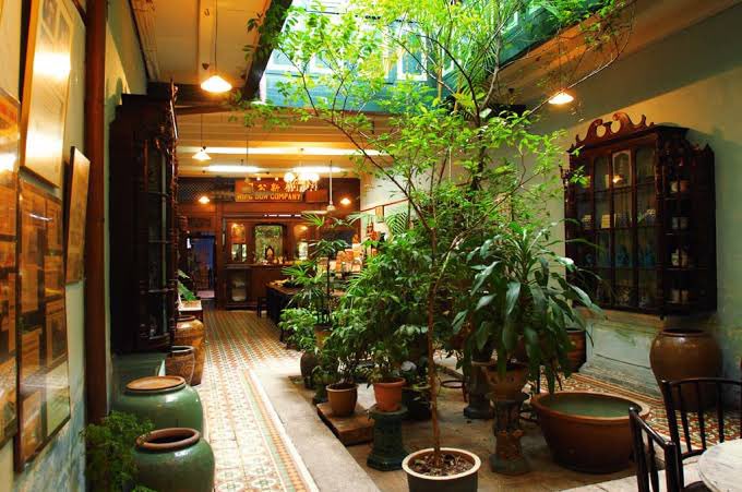 I used to live in this building – a pretty good example of a Malaysian shophouse, which combines Southern Chinese and western influences. The front room of the terrace is formal, often with an altar, while the interiors are ventilated by airwells and shutters.