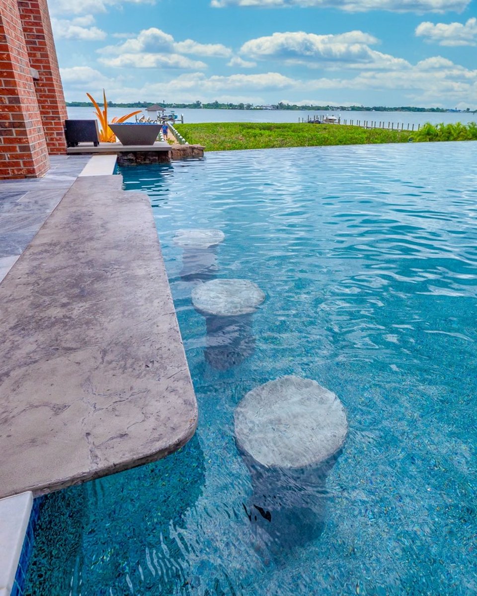 Would your #ultimatebackyard have a swim-up bar and an infinity-edge pool?

#insanepools #lucaslagoons #infinityedgepool #swimupbar