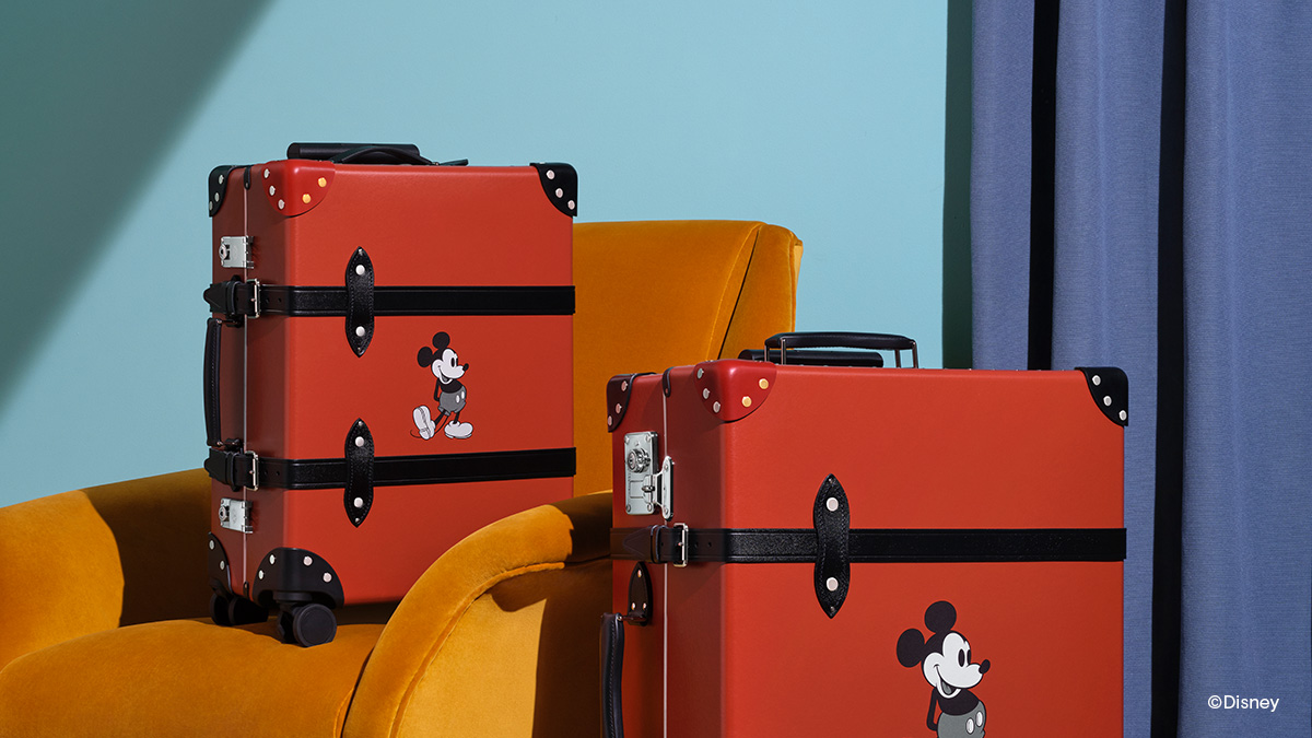 Globe Trotter Recalling Mickey Mouse S Iconic Gold Buttoned Red Trousers Every Case Features A Single Red Leather Corner With Brass Rivets Discover The New Disney This Bag Contains Magic Collection Online