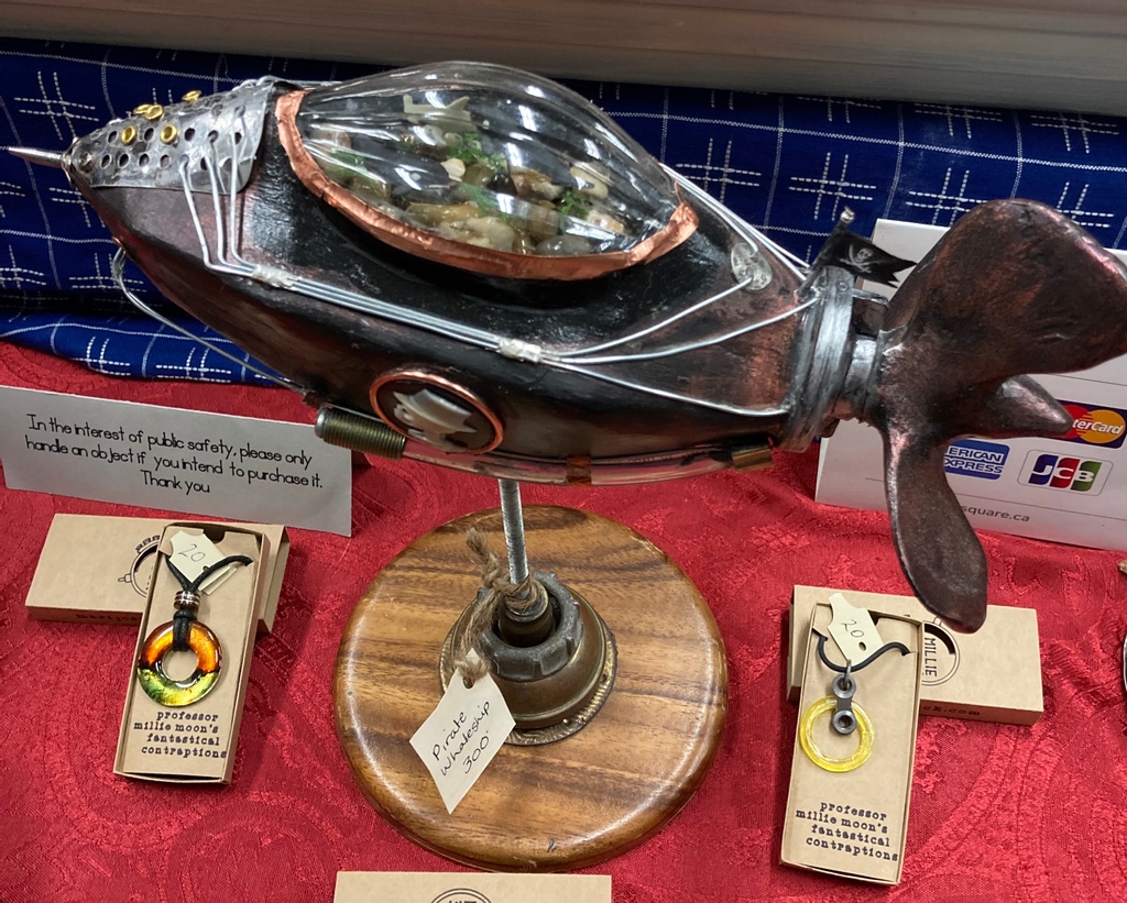 MarijoSwick's tweet photo. Only 1hr till we pack up &amp; fly! Visit me at the Geek Christmas Market going on at Centennial Hall All kinds of Geeky gifts. #steampunk #buylocal # steamunkgift #holiday market #handmade #comiccon #londoncomiccon #airship #goggles #handmadejewellery #upcycle #repurpose #mechanical https://t.co/SHXQEUYgvY