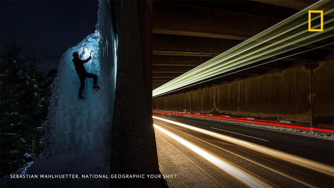 NatGeoTravel's tweet photo. An ice climber ascends a small icefall as cars speed through a tunnel in this unique image by #YourShotPhotographer Sebastian Wahlhuetter. https://t.co/qn8AVh286F