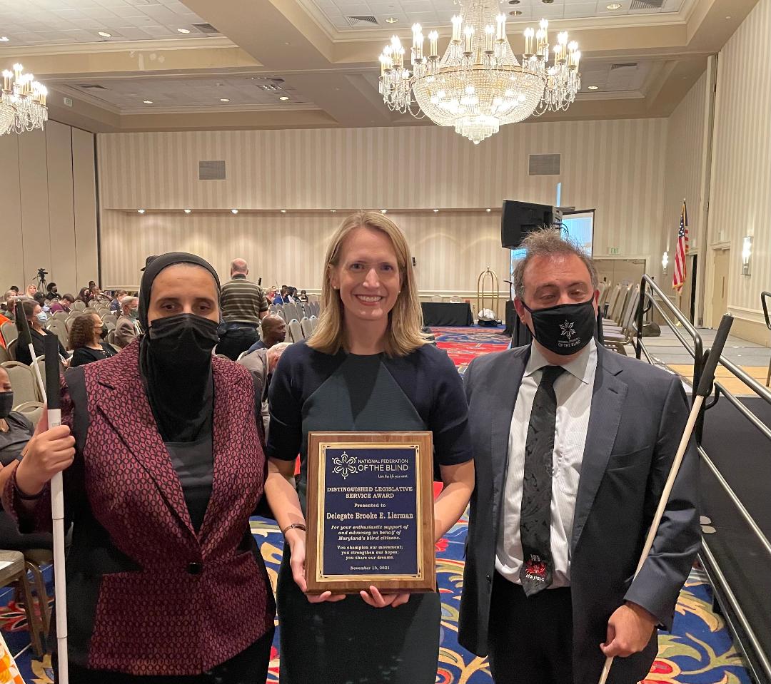 PWDforMaryland's tweet image. Congratulations to Delegate @BrookeELierman on receiving the @NFBMD Distinguished Legislative Service Award from the National Federation of the Blind of MD! Your tremendous work is appreciated. Photo of Ronza Othman (@aznor99), Brooke Lierman, and Mark Riccobono (@Riccobono).