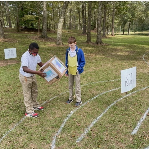 WFMSthebest's tweet photo. West Fel Explorers Club members lead sixth grade students through the water flow simulation during Club Day. https://t.co/bd8DfD165P