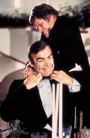 FilmsQuirky's tweet photo. Day 14: Your favourite queerest scene in any 007 film.
#30dayJamesBondChallenge #FilmTwitter📽️🎬
#DiamondsAreForever (1971)
They came together, they left together.
#SeanConnery #BruceGlover #PutterSmith 
[2 of 2]   @CasinoRoyle007 https://t.co/mdxQbZ9fhY