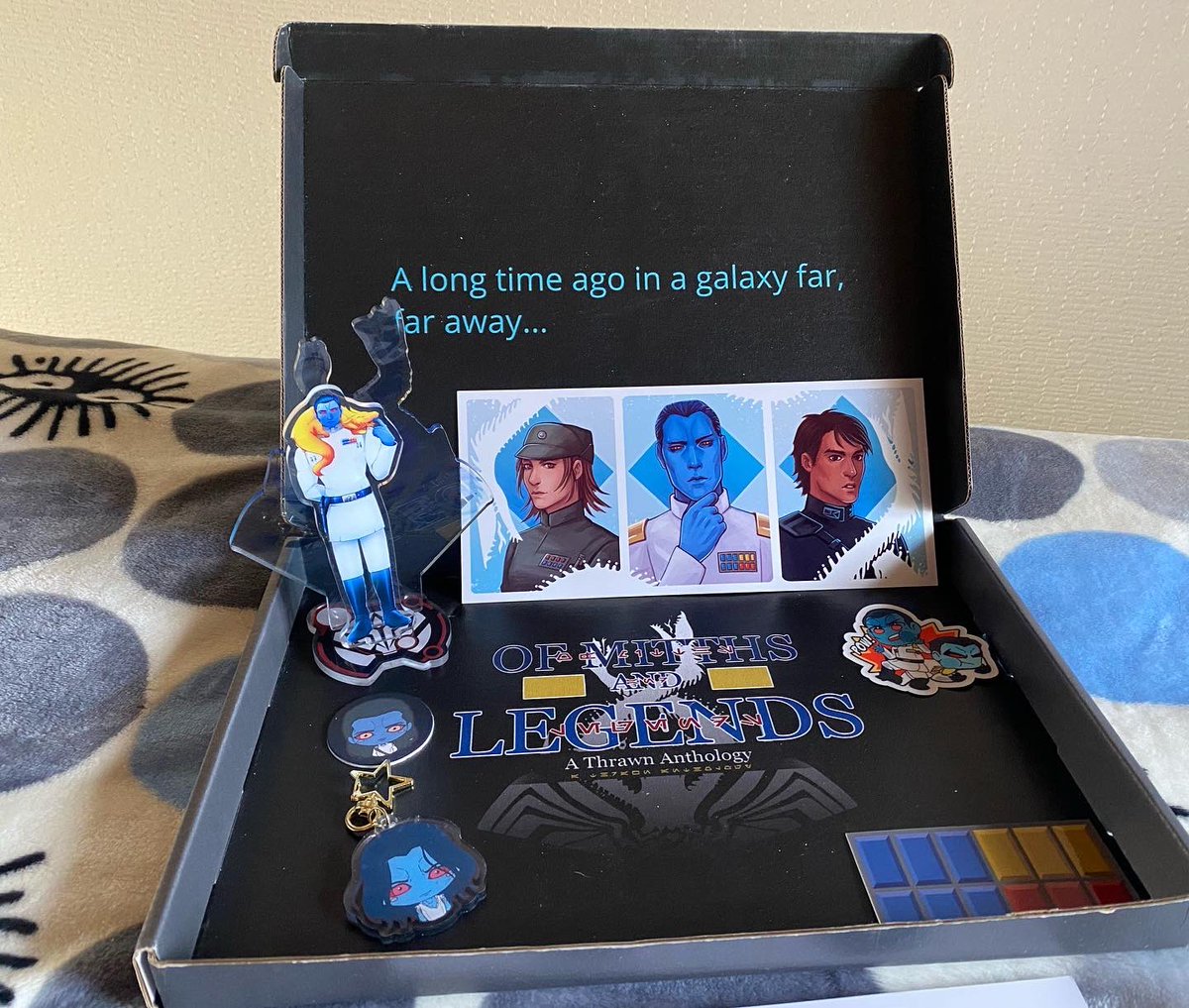 EriMinAdventure's tweet photo. Super late posting this but I absolutely LOVE my box set from @thrawnzine .The fanzine is printed in such high quality and the stickers are so cute! My favorite is the acrylic stand which will be going on my Thrawn shelf! 
#starwars #grandadmiralthrawn #thrawn #fanzine https://t.co/toEiqwUgS2