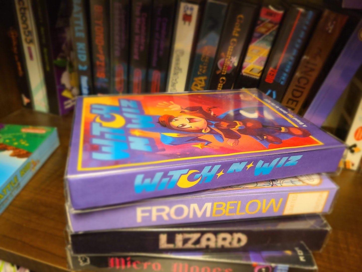 A photo of the Witch n' Wiz NES box sitting in a pile of other NES games, looking perfectly at home.