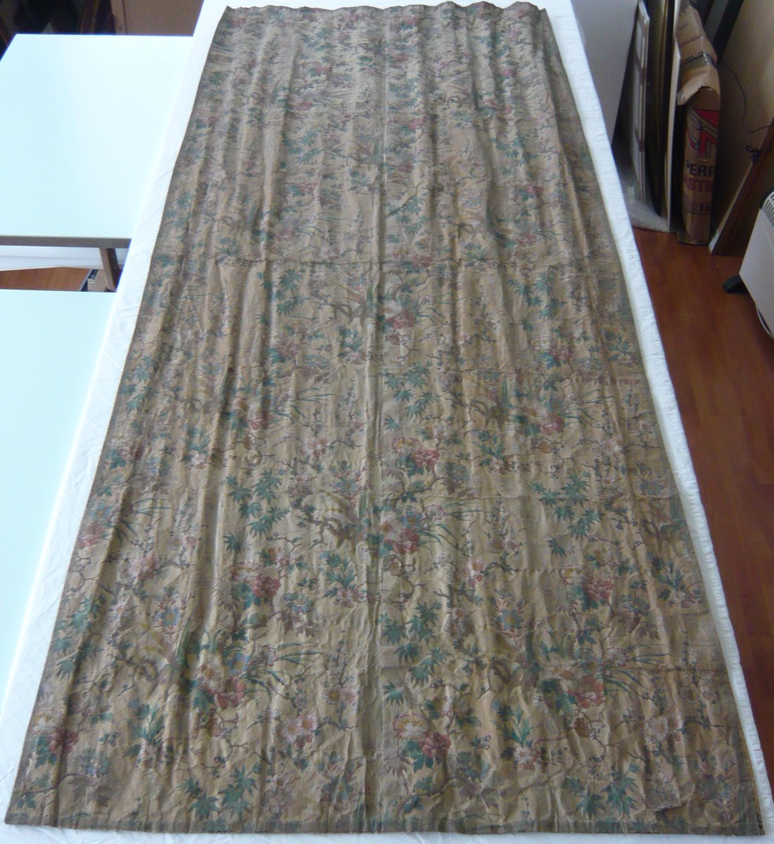 EmilyOConserve's tweet photo. Removing the grey bobbinet from the curtains reveals the fragile condition of the paper and the colours that have been hidden.
The bobbinet has done a good job of holding the curtains together, but time to change it - what do you think??
@NTmountstewart #NaplesBedHangings https://t.co/c0ZI6iJ4BC