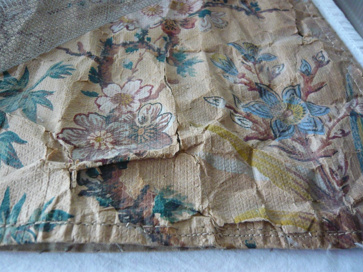 EmilyOConserve's tweet photo. Removing the grey bobbinet from the curtains reveals the fragile condition of the paper and the colours that have been hidden.
The bobbinet has done a good job of holding the curtains together, but time to change it - what do you think??
@NTmountstewart #NaplesBedHangings https://t.co/c0ZI6iJ4BC