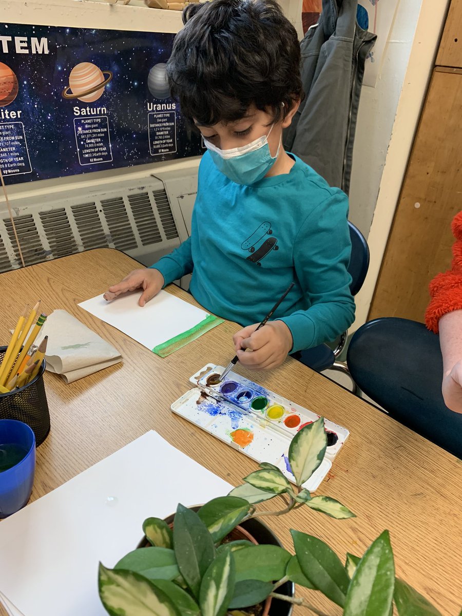 Exploring watercolor paints during centers today.