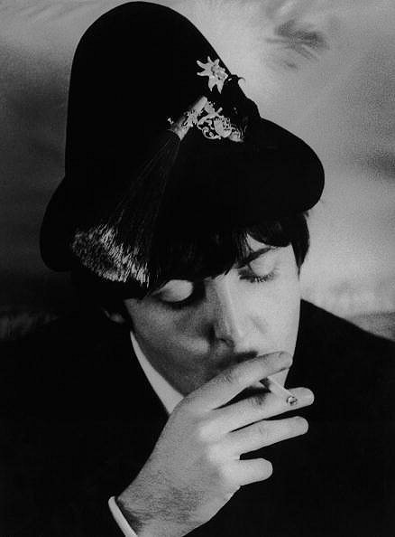 Paul McCartney — he’s wearing a Bavarian hat on a BEA flight to Munich, 1966.