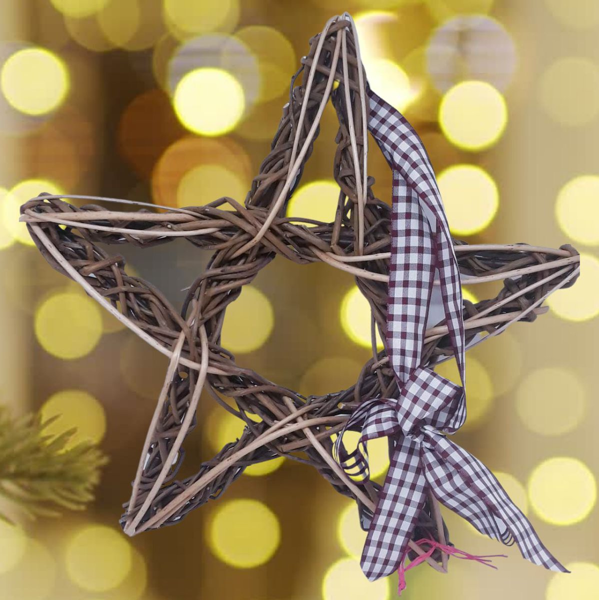 A festive star woven from willow with a checked ribbon and a sparkly background.