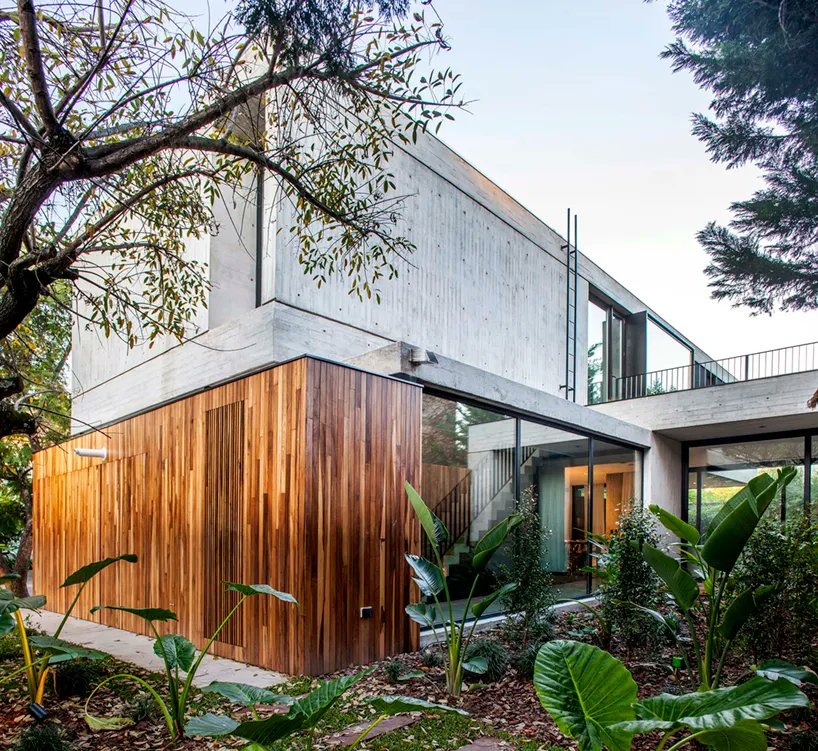 designboom's tweet photo. this house in buenos aires is a concrete box that floats above a garden lagoon. https://t.co/eMz6nVRTZ0 https://t.co/4A2asdaaXJ