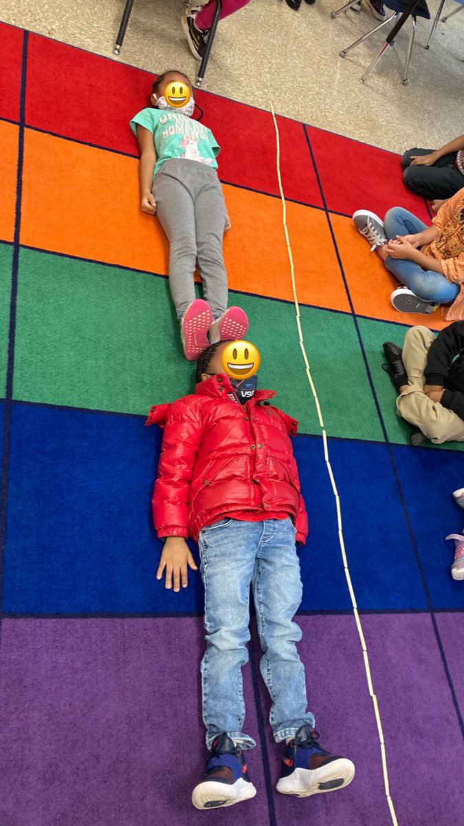 Today we predicted which would be longer: students, or our 25 popsicle sticks. 25 popsicle sticks was longer than these 2 friends, but 3 friends were even longer than that! #KindergartenMath #Bridges #CalendarCollector #WeAreFeatherbedLane