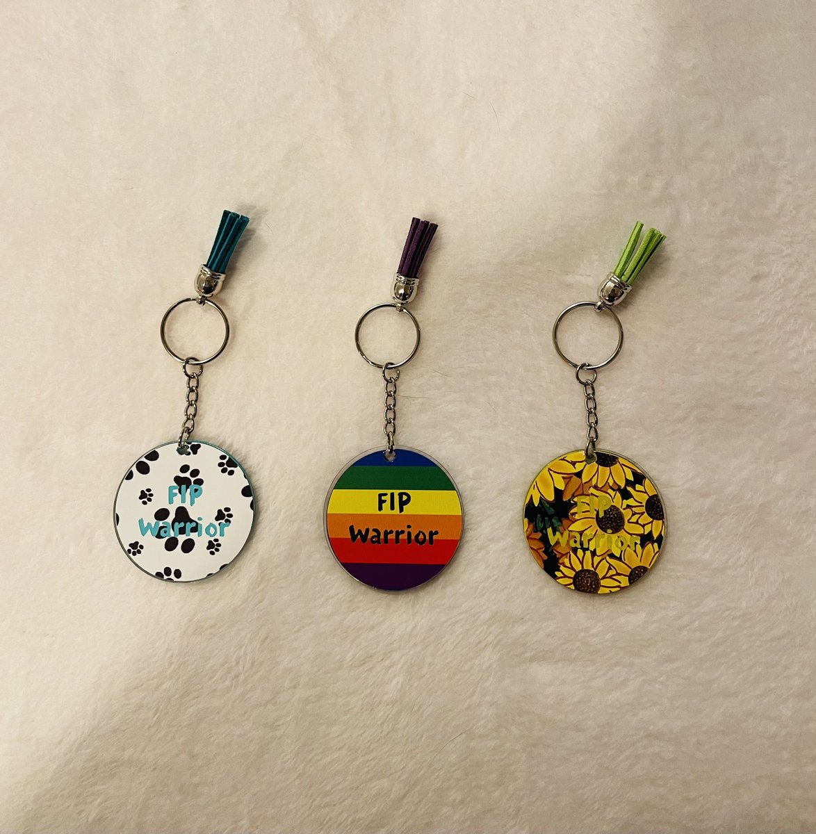 Rainbow__nerds's tweet photo. We’ve been making these FIP Warrior keychains for cats who are undergoing FIP treatment or have completed it. We’re going to try out the heart vinyl next (last photo). All funds raised go to our Jirou’s medical bills: https://t.co/UA6CMF0u69 #fipwarrior #fipsucks #fipcat #fip https://t.co/ozfGminhJP