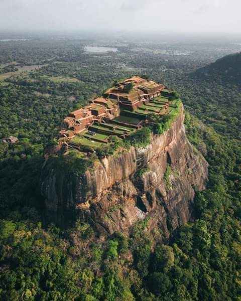 Sigiriya (Lion Rock Sinhala) an ancient rock fortress located in northern Matale District near town of Dambulla in Central Province, Sri Lanka. 
Many rock shelters and caves in vicinity were occupied by Buddhist monks and ascetics from early 3rd century BC.

#archaeohistories
