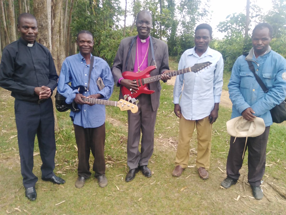 Meeting local guitarists after a church service at Emmanuel parish, Elwakana-Kenya.They enrich our worship with local flavor.